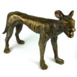 A HEAVY SOLID BRASS STATUE, HUNTING DOG. (37cm x 26cm) Condition: good