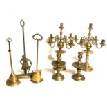 A MIXED LOT OF 19TH CENTURY AND LATER BRASS To include brass door stops, fire irons, a pair of