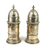 A LARGE PAIR OF EARLY 20TH CENTURY SILVER SUGAR SIFTERS With detachable pierced domed top and