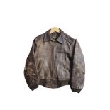 A VINTAGE BROWN LEATHER PILOTS JACKET Bearing interior label marked 'Steerhide'. Condition: wear