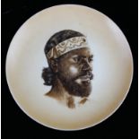 A RARE EARLY 20TH CENTURY CONTINENTAL ABORIGNAL HARD PASTE PORCELAIN PLATE, CIRCA 1900 Centrally