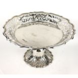 A VICTORIA SILVER CIRCULAR TAZZA With scrolled edge and pierced design to gallery, on a pedestal