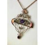 AN ART NOUVEAU 9CT GOLD, AMETHYST AND SEED PEARL PENDANT NECKLACE A central round cut amethyst in