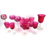 A COLLECTION OF VICTORIAN AND LATER CRANBERRY GLASS To include three Bohemian overlaid wine