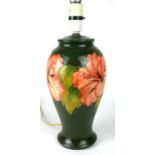 A MID 20TH CENTURY MOORCROFT POTTERY LAMP BASE Tube-lined with leaf pattern on green lustre