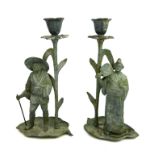 A PAIR OF EARLY 20TH CENTURY CONTINENTAL JAPANESQUE DESIGN METAL CANDLESTICKS MODELLED AS GEISHA AND