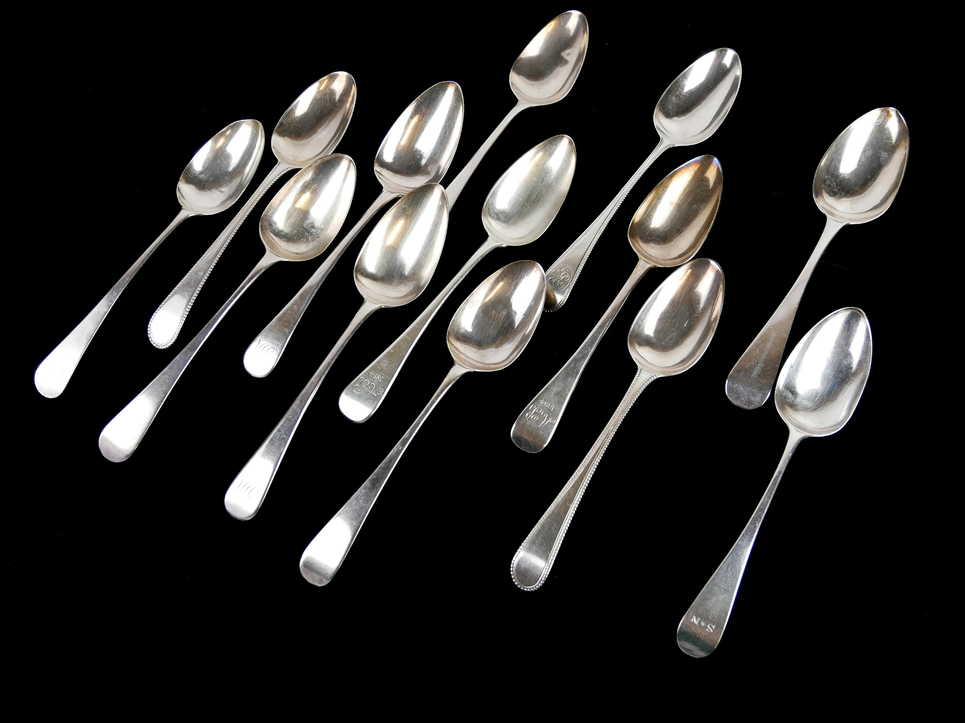 A COLLECTION OF GEORGIAN SILVER TABLESPOONS Various hallmarks to include RC, London, 1787 and
