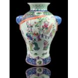 A CHINESE FAMILLE VERTE PORCELAIN EXPORT BALUSTER VASE Enamelled with various figures in a garden