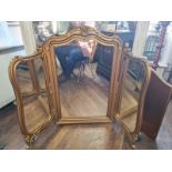 A LARGE LATE VICTORIAN GILT FRAMED TRIPTYCH TABLE TOP DRESSING MIRROR, crested with floral