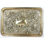 AN EDWARDIAN SILVER RECTANGULAR DRESSING TABLE TRAY With embossed floral decoration, hallmarked