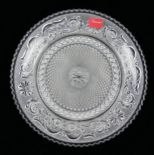BACCARAT, A FRENCH CUT LEAD CRYSTAL CIRCULAR PLATE With embossed scrolls and cut spiral design to