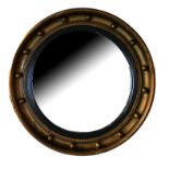 A REGENCY GILT FRAMED CIRCULAR CONVEX MIRROR. (diameter 42cm) Condition: one ball in frame missing