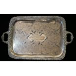 AN EARLY 20TH CENTURY GEORGE V PERIOD SHEFFIELD HEAVY SILVER PLATED TWIN HANDLED SERVING TRAY Having