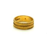 A 22CT GOLD WEDDING BAND Having a herringbone design. (approx 5g, size K) Condition: good