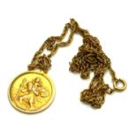 A VINTAGE 9CT GOLD CIRCULAR ST. CHRISTOPHER PENDANT NECKLACE With embossed figural decoration on a