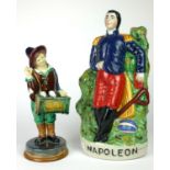 A 20TH CENTURY STAFFORDSHIRE TYPE FIGURE OF NAPOLEON In standing position, painted in bright colours