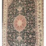 A LARGE PERSIAN DESIGN WOOLLEN RUG The central field contained in running borders. (330cm x 250cm)