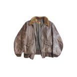 A VINTAGE BROWN LEATHER PILOTS JACKET Marked 'Goatskin USA', with fur collar. Condition: some wear