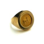 A 22CT GOLD SOUTH AFRICAN 1/10 KRUGERRAND COIN RING, DATED 1980 With embossed springbok and portrait