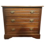 A LATE VICTORIAN MAHOGANY CHEST OF THREE LONG DRAWERS The lifting top above, raised on bracket feet.