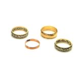 TWO 9CT GOLD WEDDING RINGS To include a wide band with engraved decoration to edge, together with
