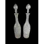A PAIR OF VINTAGE CUT GLASS DECANTERS Elongated neck with facets to body. Condition: good