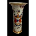 A 19TH CENTURY CONTINENTAL ARMORIAL PORCELAIN VASE Along with a pair of greyhounds with shields. (