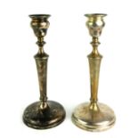 A PAIR OF EDWARDIAN PLAIN SILVER CANDLESTICKS On circular bases, hallmarked London, 1910. (approx