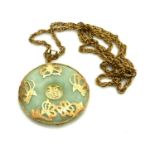 A VINTAGE 14CT GOLD AND CHINESE CIRCULAR JADE PENDANT With gold pierced decoration of insects, on