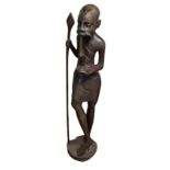 AN AFRICAN HARDWOOD WOODEN CARVING, PIPE SMOKING TRIBAL ELDER. (103cm) Condition: good