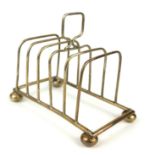 WALKER AND HALL, AN EDWARDIAN SILVER RECTANGULAR TOASTRACK With pierced frame, on ball feet,