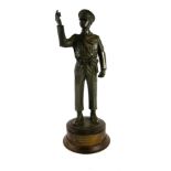 PETER HICKS, A 20TH CENTURY BRONZED STANDING MILITARY FIGURE OF A WWII RAF PILOT On a turned