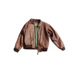A VINTAGE BROWN LEATHER JACKET Bearing interior label 'Redskins', green satin lined (approx size M).