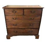 A GEORGIAN MAHOGANY CHEST OF TWO SHORT ABOVE THREE LONG DRAWERS Fitted with brass escutcheons and