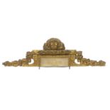 AN 18TH/19TH CENTURY CARVED GILTWOOD OVER DOOR CREST The central lion mask flanked by foliage,