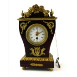 A 19TH FRENCH TORTOISESHELL AND GILT METAL CASED CLOCK Having a circular white enamelled dial and