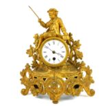 A LATE 19TH CENTURY FRENCH ROCOCO GILT METAL FIGURAL MANTEL CLOCK Having a pierced body with foliage