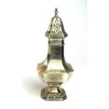 AN EARLY 20TH CENTURY SILVER SUGAR CASTER Having a pierced domed top with gadrooned edge, hallmarked