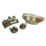 A 19TH CENTURY SILVER PLATE ON COPPER INKSTAND Set with detachable chamberstick and two glass