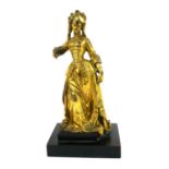 A 19TH CENTURY GILT BRONZE FIGURE, STANDING FEMALE FIGURE Dressed in 18th Century attire with one