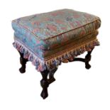 AN 18TH CENTURY AND LATER WALNUT STOOL With overstuffed upholstered seat, raised on fluted vase