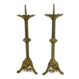 A PAIR OF 20TH CENTURY BRASS ECCLESIASTICAL PRICKET CANDLESTICKS Pierced sconce with embossed