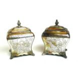A PAIR OF GEORGIAN DESIGN SILVER PLATED CYLINDRICAL TEA CADDIES With engraved decoration and