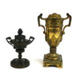 A 19TH CENTURY GILT BRONZE CLASSICAL URN FORM CANDLESTICK Twin handles with embossed floral insert