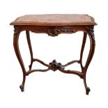 A LATE 19TH CENTURY MAHOGANY CENTRE TABLE Having an inset rouge marble top and carved apron, on