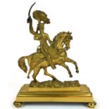 A 19TH CENTURY BRASS EQUESTRIAN DOOR STOP The cavalry officer with feathered plume to helmet and