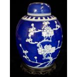 A 20TH CENTURY BLUE AND WHITE PORCELAIN GINGER JAR AND COVER Decorated with medallions of prunes
