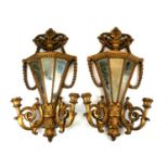 A PAIR OF 19TH CENTURY CONTINENTAL GILDED CARVED WOOD TWO BRANCH WALL LIGHT WALL SCONCES OF