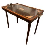 AN EDWARDIAN BUTLERS MAHOGANY AND SHELL MARQUETRY INLAID TRAY TABLE With brass handles, on