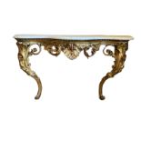 A 19TH CENTURY CONSOLE TABLE With serpentine white marble top on an organic carved and pierced